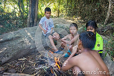 Children in countryside Thailand fire after playing in water a l Editorial Stock Photo