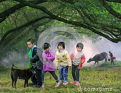 Children crossing farm field, China countryside Editorial Stock Photo