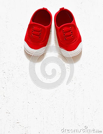 Children cute red small sized canvas shoes top view overhead s Stock Photo