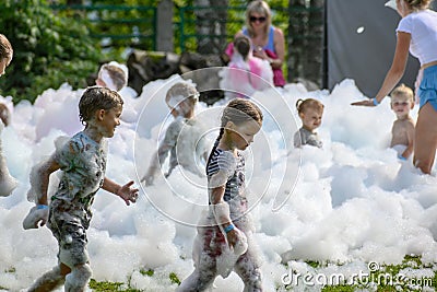 children dance and relax at the foam disco in Aizkraukle 2 Editorial Stock Photo