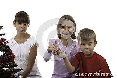 Children decorate a New Year tree Stock Photo