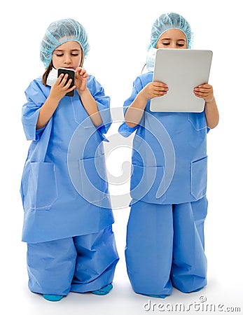 Children doctor with tablet and phone Stock Photo