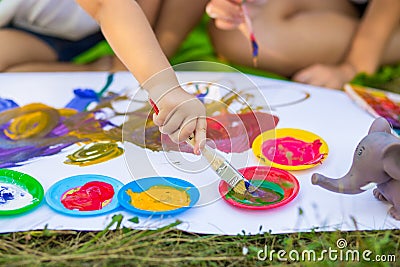 Children draw in summer park Stock Photo