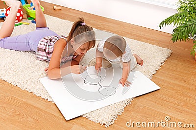 Children drawing in room Stock Photo