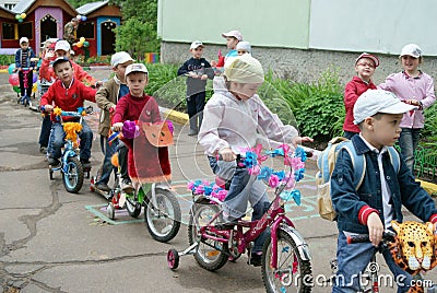 Children driving on designer bicycles and scooters in Russia Editorial Stock Photo