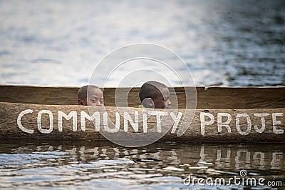 Children in a dugout canoe on Lake Bunyonyi Editorial Stock Photo