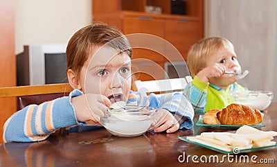 Children eating dairy breakfast Stock Photo