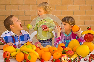 Children eating fruits Stock Photo