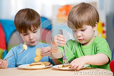 Children eating healthy food at home Stock Photo