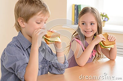 Children eating sandwiches. Stock Photo