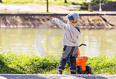 Children on the edge of the river Stock Photo