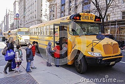 Children entering school bus. Editorial Stock Photo