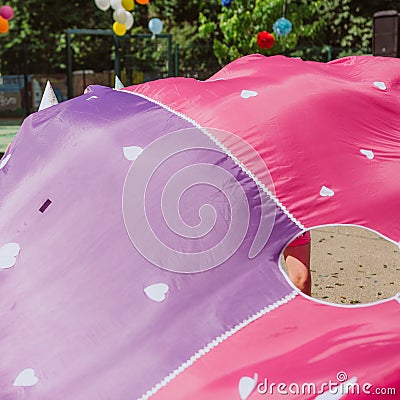 children entertainment fabric parachute wind hide waves Stock Photo