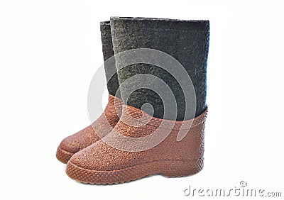 Children felt black boots with brown rubber galoshes. Stock Photo