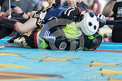 Rimini, Italy - may 2019: Children Fighting a Boxing Match on the Ground in the Ring with Head and Leg Protections Editorial Stock Photo