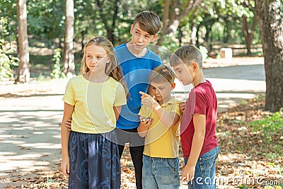 Children in the forest use a compass to study the direction of movement. The concept of children and adolescents outdoor Stock Photo