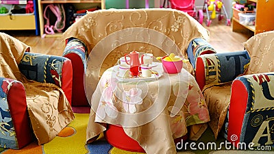 Children furniture stands in the play area in the kindergarten Stock Photo
