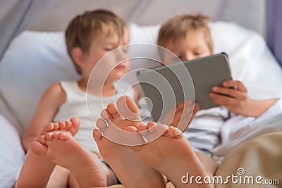 Children and gadgets Kids with tablet Alternative education concept Social communication disorder. Evolve toward a Stock Photo