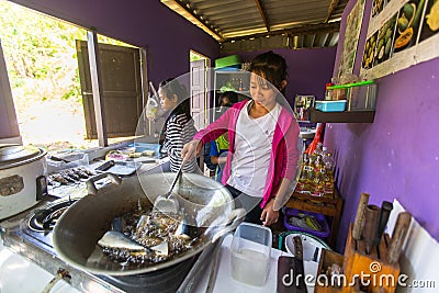 Children get food at lunch time at school by project Cambodian Kids Care to help deprived children in deprived areas on Koh Chang Editorial Stock Photo