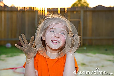 Children girl playing with mud sand ball and dirty hands Stock Photo