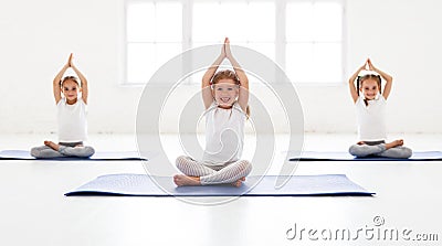 Children girls doing yoga and gymnastics in gym Stock Photo