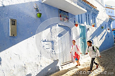 Children going to school in a hurry in the early morning Editorial Stock Photo