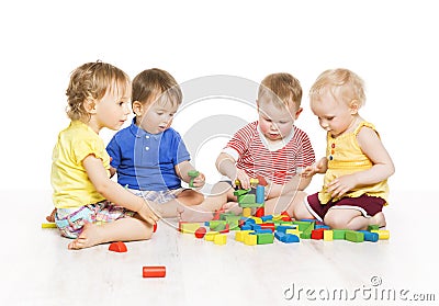 Children Group Playing Toy Blocks. Little Kids Early Development Stock Photo