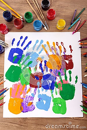 Children handprints and art equipment, art and craft class, school desk, classroom Stock Photo