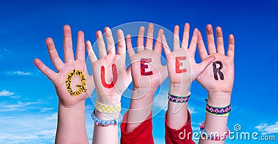 Children Hands Building Word Queer, Blue Sky Stock Photo