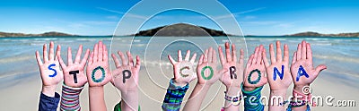 Children Hands Building Word Stop Corona, Ocean Background Stock Photo