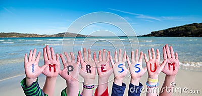 Children Hands Building Word Impressum Means Imprint, Ocean And Sea Stock Photo