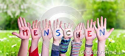 Children Hands Building Word Menschen Means Human, Grass Meadow Stock Photo