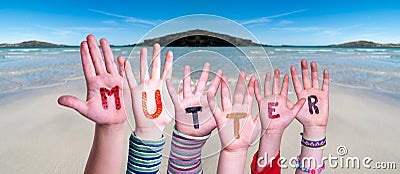 Children Hands Building Word Mutter Means Mother, Ocean Background Stock Photo