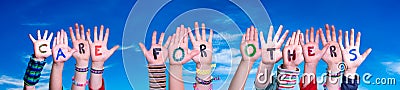 Children Hands Building Word Care For Others, Blue Sky Stock Photo