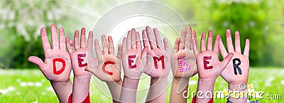 Children Hands Building Word December, Grass Meadow Stock Photo