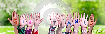 Children Hands Building Word Give Thanks, Grass Meadow Stock Photo