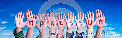 Children Hands Building Word Impressum Means Imprint, Blue Sky Stock Photo