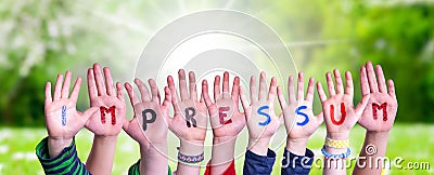 Children Hands Building Word Impressum Means Imprint, Grass Meadow Stock Photo