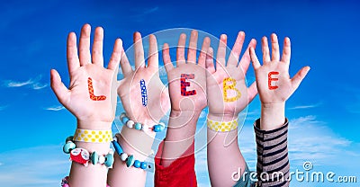 Children Hands Building Word Liebe Means Love, Blue Sky Stock Photo