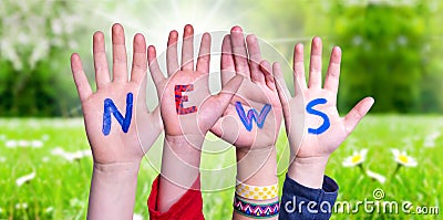 Children Hands Building Word News, Grass Meadow Stock Photo