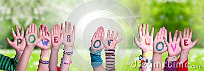 Children Hands Building Word Power Of Love, Grass Meadow Stock Photo