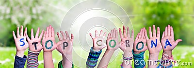 Children Hands Building Word Stop Corona, Grass Meadow Stock Photo