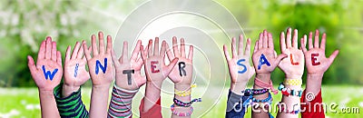 Children Hands Building Word Winter Sale, Grass Meadow Stock Photo