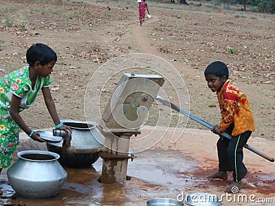 A Children have gathered in the hand pump for water Editorial Stock Photo