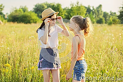 Children are having fun in nature, two girls laugh Stock Photo