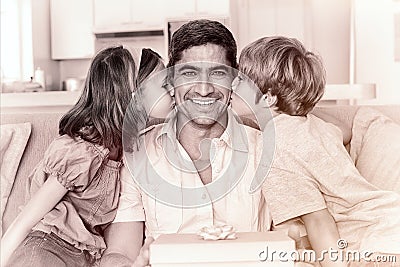 Children kissing on fathers cheeks Stock Photo