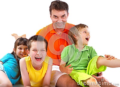 Children laughing with uncle Stock Photo