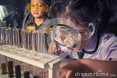children leaning about chemistry in science examination laboratory Stock Photo