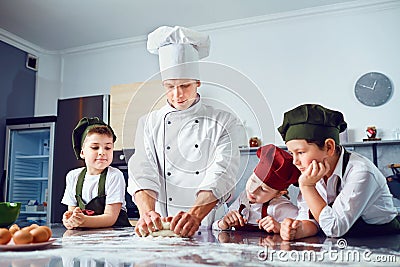 Children learn to cook in the classroom in the kitchen Stock Photo