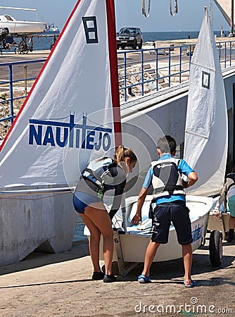 Children are learning sailing with a small boat Editorial Stock Photo